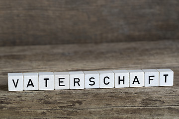 Image showing German word fatherhood, written in cubes