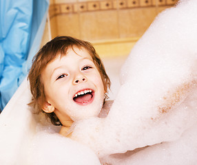 Image showing little cute boy in bathroom with bubbles close up smiling, lifes