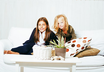 Image showing two cute sisters at home playing, little girl in house interior 