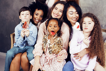 Image showing Lifestyle and people concept: young pretty diversity nations woman with different age children celebrating on birth day party together happy smiling, making selfie. African-american, asian and caucasi