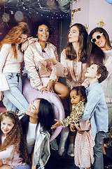 Image showing Lifestyle and people concept: young pretty diversity nations woman with different age children celebrating on birth day party together happy smiling, making selfie. African-american, asian and caucasi