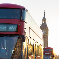 Image showing Red double-decker buses passing on Westminster Bridge in London, UK.