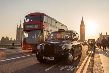 Image showing Traffic and random people on Westminster Bridge in sunset, London, UK.