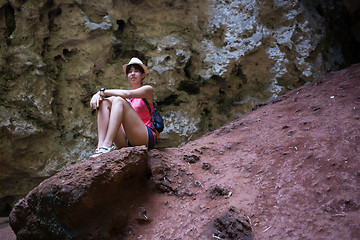 Image showing Girl on hill among mountains