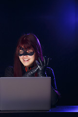 Image showing Brunette thief in black mask