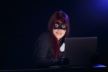 Image showing Woman spy in black mask