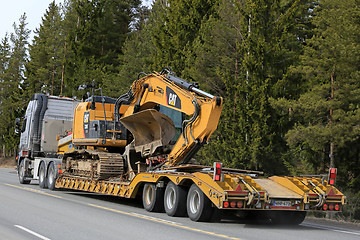Image showing Volvo FH16 transports Cat Tracked Excavator on Trailer