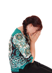 Image showing A crying woman with hands over face.