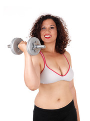 Image showing Busty woman with dumbbells.