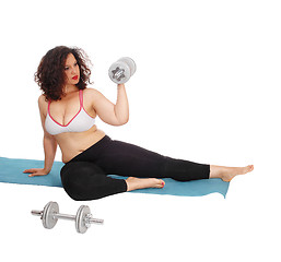 Image showing Woman lifting dumbbells.