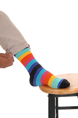 Image showing Closeup of foot with colorful socks.