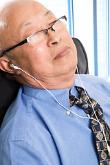 Image showing Relaxed senior asian businessman