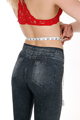 Image showing Woman measuring her waist.