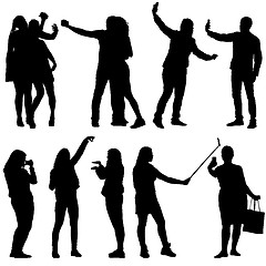 Image showing Set silhouettes man and woman taking selfie with smartphone on white background. illustration