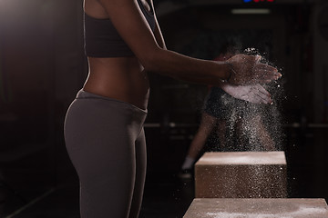 Image showing black woman preparing for climbing workout