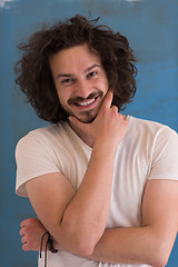 Image showing young man with funny hair over color background