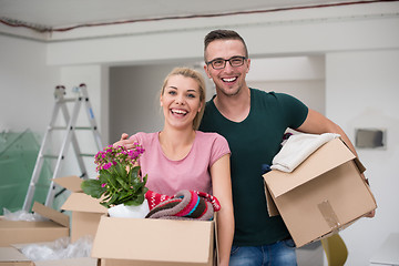 Image showing young couple moving into a new home