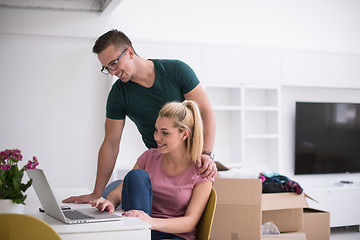 Image showing Young couple moving in a new home