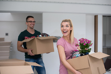 Image showing young couple moving into a new home