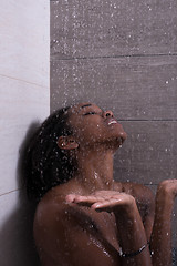 Image showing African American woman in the shower