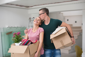 Image showing young couple moving into a new home