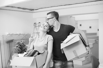 Image showing young couple moving into a new home