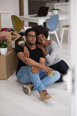 Image showing African American couple relaxing in new house