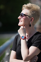 Image showing young woman with short blond hair and sunglasses