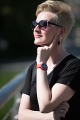 Image showing young woman with short blond hair and sunglasses