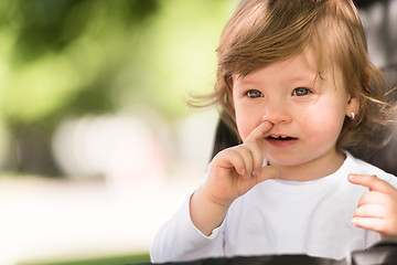 Image showing baby girl sitting in the pram