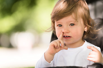 Image showing baby girl sitting in the pram