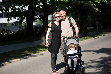 Image showing couple with baby pram in summer park