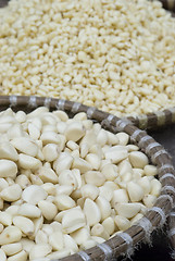 Image showing Peeled garlic at a market