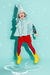 Image showing Little girl posing in fashion style wearing autumn clothing.