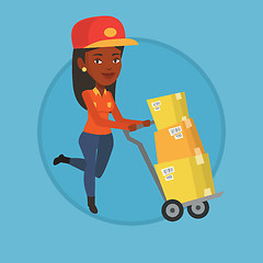 Image showing Delivery postman with cardboard boxes on trolley.