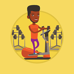 Image showing Man exercising on elliptical trainer.