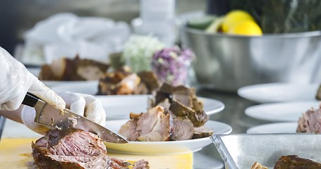 Image showing Preparing meat on the table