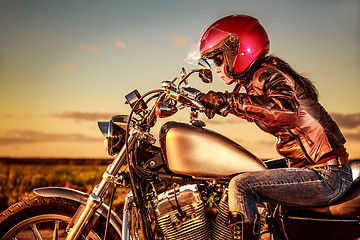 Image showing Biker girl on a motorcycle