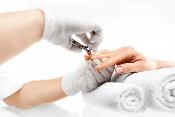 Image showing Manicure, cutting skins woman to a beautician