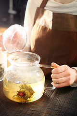 Image showing Blooming tea brewed in a glass jug.