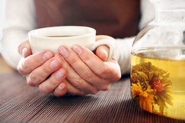 Image showing Blooming tea brewed in a glass jug. Blooming tea.