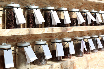 Image showing Coffee roaster Shelf with jars of coffee beans 