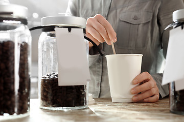 Image showing Coffee to go. Female sweetened coffee 