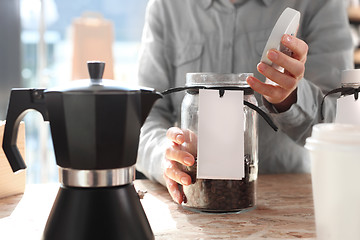 Image showing Barista prepares coffee Pressure coffee percolator coffee makers Teapot coffee