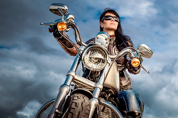 Image showing Biker girl on a motorcycle