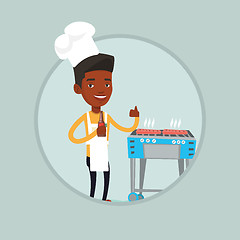 Image showing Man cooking steak on gas barbecue grill.