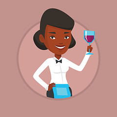 Image showing Bartender holding a glass of wine in hand.