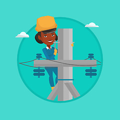 Image showing Electrician working on electric power pole.