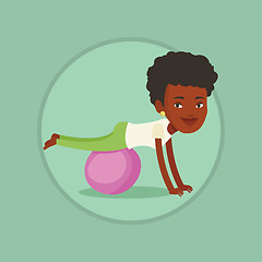 Image showing Young woman exercising with fitball.