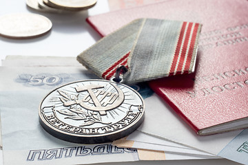 Image showing Veteran's medal of labor, pension certificate and money